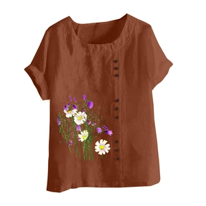 Detail of terracotta cotton linen blouse showing floral print and side button closure