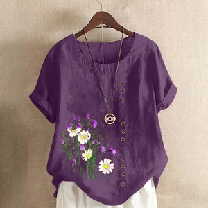 Detail of wooden buttons and daisy print on the purple cotton linen shirt for women