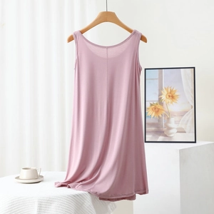 Detailed texture of pink modal sleeveless dress with soft drape and round neckline