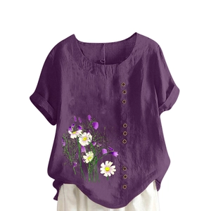 Detailed view of purple linen shirt featuring wood buttons and daisy print hem details