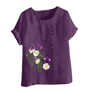 Detail of floral daisy print and vertical button design on purple cotton linen blouse