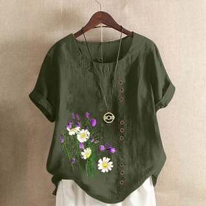 Detail of army green cotton linen shirt with floral print and decorative buttons