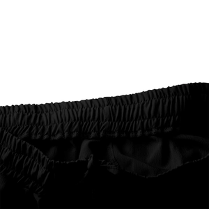 Détail de la taille élastique avec cordon de serrage sur un pantalon noir décontracté