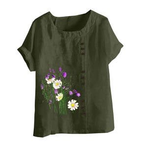 Detail of olive green cotton linen top with daisy print and side button accents