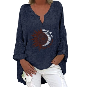 Detail of sun and moon print on navy cotton linen V-neck top with artistic lettering