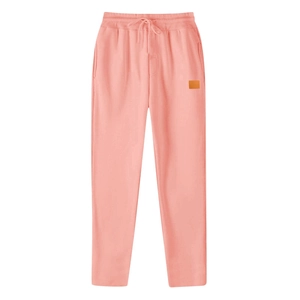 Detail shot of the orange decorative leather patch on light coral casual joggers for men