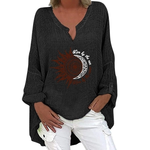 Detail of V-neck blouse showing sun and moon print with Live by the sun text