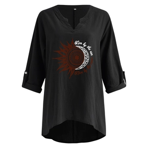 Detail of sunflower mandala print and button roll-up sleeves on black linen v-neck shirt
