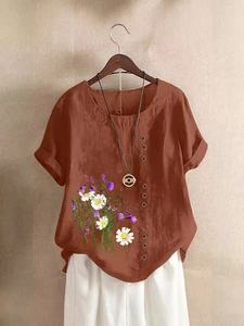 Women's rust red cotton linen short sleeve top with floral print and decorative buttons