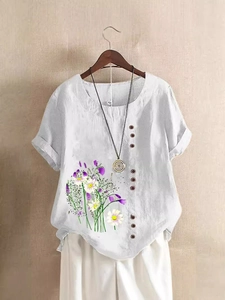 Women's white linen short sleeve shirt with floral daisy print and button detail