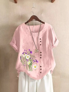 Pink cotton linen short sleeve shirt with floral print and decorative buttons on front