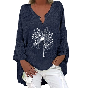 Detail of V-neck navy cotton linen top with white dandelion print and asymmetric hemline