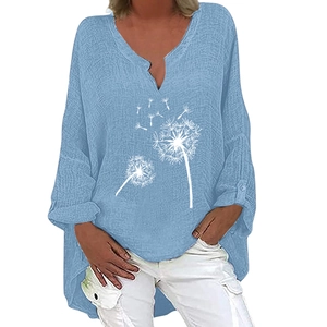 Detail of light blue cotton linen blouse showing V-neck and white dandelion print texture