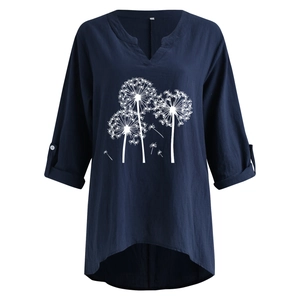 Detail of navy blue cotton linen tunic with dandelion print and button-up rolled sleeves