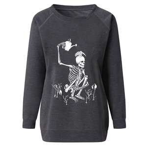 Detail of loose-fit grey sweatshirt featuring a white skeleton watering a head sprout