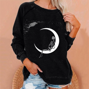 Detail of moon and skeleton graphic print on a loose fit black long-sleeved sweatshirt