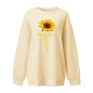 Close-up of sunflower print and Jesus script on beige drop-shoulder sweatshirt