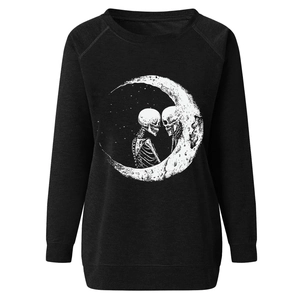 Detailed macro view of the gothic skull and moon print on black cotton sweatshirt