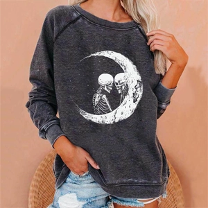 Detail view of the moon and skull graphic print on dark grey acid wash sweatshirt
