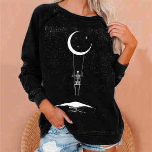 Close-up of skeleton on moon swing print on black loose-fit crewneck sweatshirt