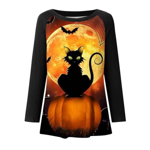 Close-up of Halloween long sleeve shirt featuring a black cat on a pumpkin and full moon