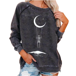 Detail of loose fit charcoal grey sweatshirt featuring moon and skeleton graphic print