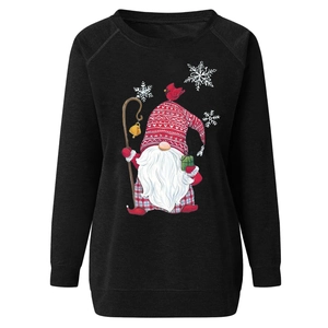 Close-up of festive Christmas gnome print with red hat on black crewneck sweatshirt