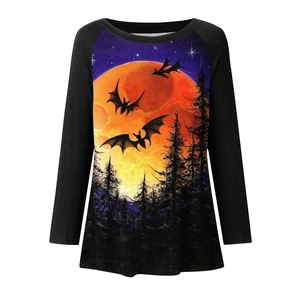 Detail of Halloween long sleeve shirt featuring orange moon, bats, and pine forest print