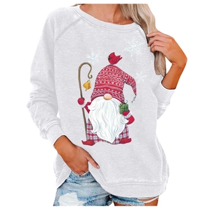 Close-up of festive gnome graphic print on a white long-sleeved crewneck sweatshirt