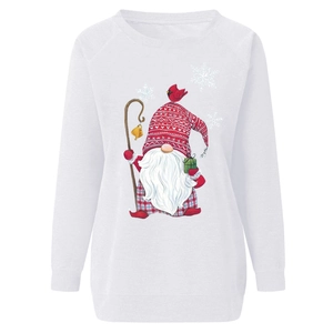 Detailed view of festive gnome print and snowflakes on a white crewneck sweatshirt