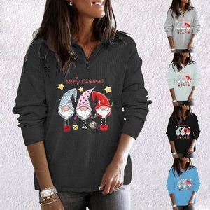 Detail view of ribbed texture and festive gnomes print on women's half-zip sweatshirt
