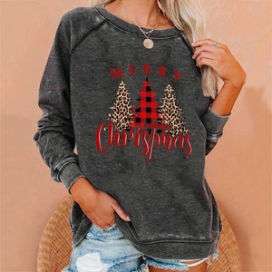 Detail of Christmas tree prints and Merry Christmas lettering on charcoal grey sweatshirt