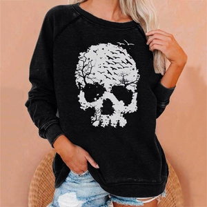Detail of artistic skull print made of dry wood and birds on loose black sweatshirt