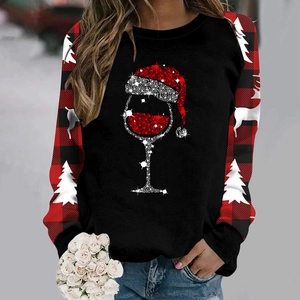 Detail of Christmas hoodie with raglan plaid sleeves and wine glass festive print