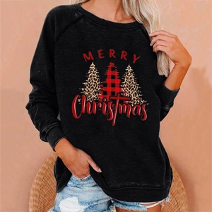 Detail of Christmas sweatshirt with leopard print holiday trees and red Merry text