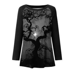 Close-up of gothic forest print and contrasting raglan sleeves on a long sleeve T-shirt