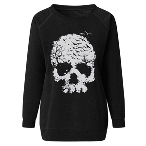 Detail of artistic skull print on black sweatshirt featuring creative branch and bird elements