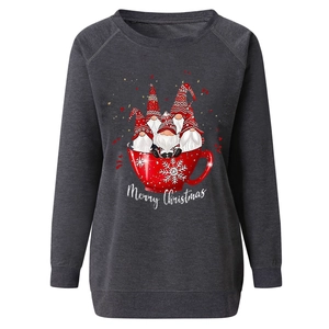Detail of Christmas gnomes print and Merry Christmas text on charcoal grey sweatshirt