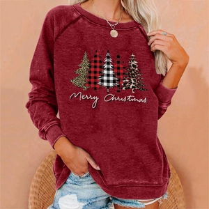 Detail of Christmas tree print on burgundy sweatshirt with Merry Christmas text