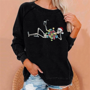 Detail of a casual black sweatshirt with a festive skeleton wearing a red Santa hat print