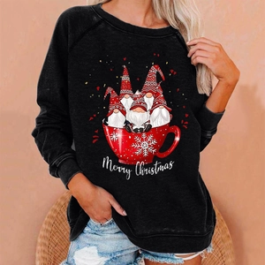 Detail showing high-quality Christmas gnome print and Merry Christmas text on black sweater