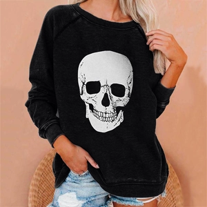 Close-up of the white skull print on a black loose sweatshirt for women