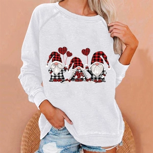 Detail of Christmas gnomes print on a casual white long-sleeve crewneck sweatshirt for women