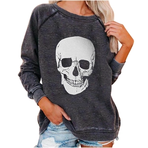 Detail of grey raglan sleeve sweatshirt featuring a bold white skull print for Halloween