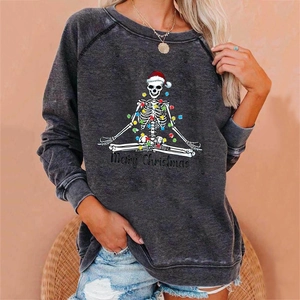 Detail of grey crewneck sweatshirt with festive meditation skeleton print and text