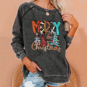 Close-up of a dark grey Christmas sweatshirt with colorful Merry Christmas prints