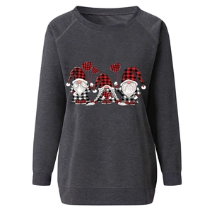 Close-up of Christmas gnomes print on dark grey crewneck sweatshirt with ribbed cuffs