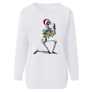Close-up of skeleton with Christmas hat print and ribbed cuffs on white sweatshirt