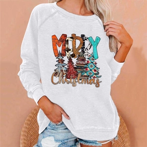 Detail of loose white Christmas sweatshirt showing Merry Christmas print and festive trees