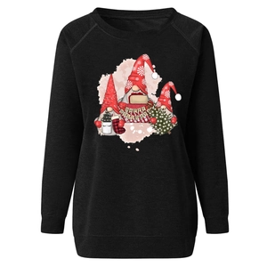 Detailed view of Christmas gnomes print with Happy Holidays text on black sweatshirt